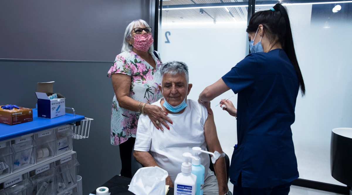 Ezra Halili, a chronic leukemia patient, receives his third dose of a COVID-19 vaccine at Sheba Medical Center on July 14, 2021, in Ramat Gan, Israel.