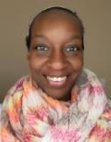 Leslie Jones Jackson smiles with a multi-colored scarf.