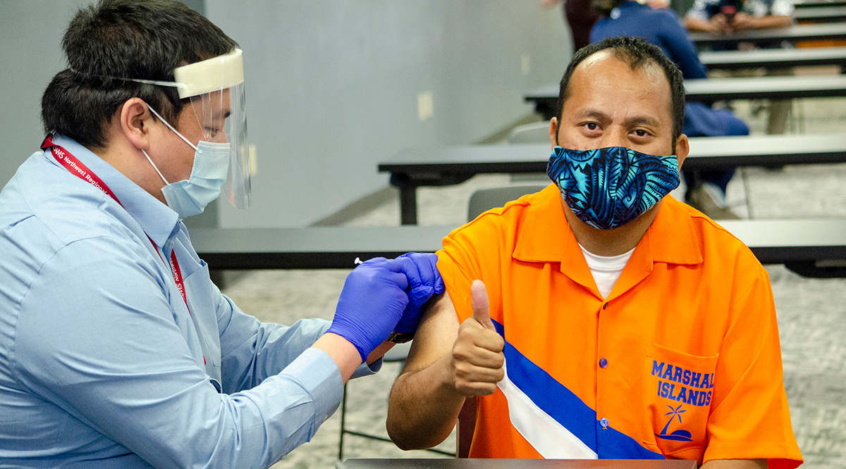 Albious Latior receives a COVID-19 vaccine at a Marshallese vaccination clinic at the University of Arkansas for Medical Sciences earlier this year.