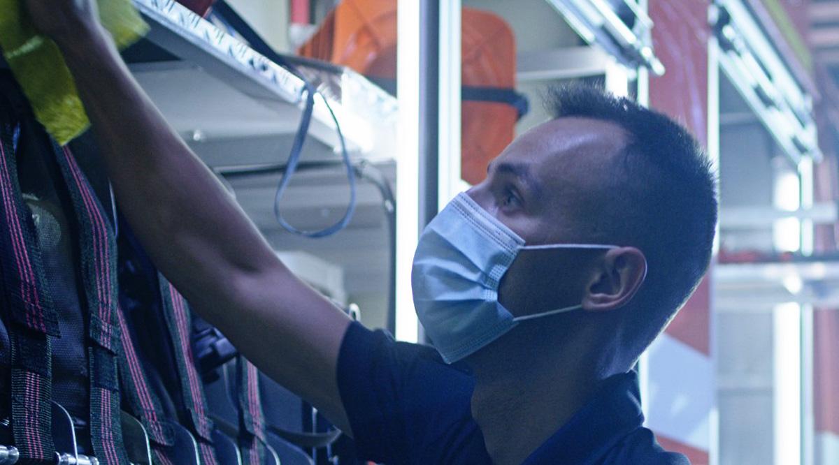 A closeup of a firefighter wearing a mask