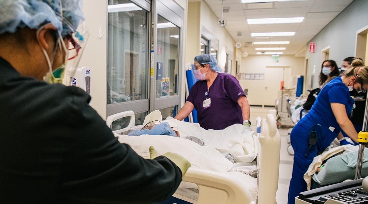 Emergency Room nurses tend to patients in a hallway at the Houston Methodist The Woodlands Hospital on August 18, 2021, in Houston, Texas.