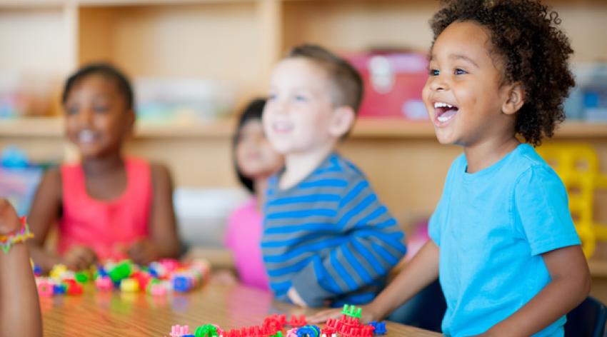 Kindergarten children playing with toys.